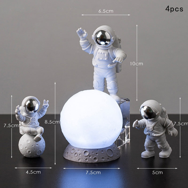 Astronaut and Moon Glow Figurines